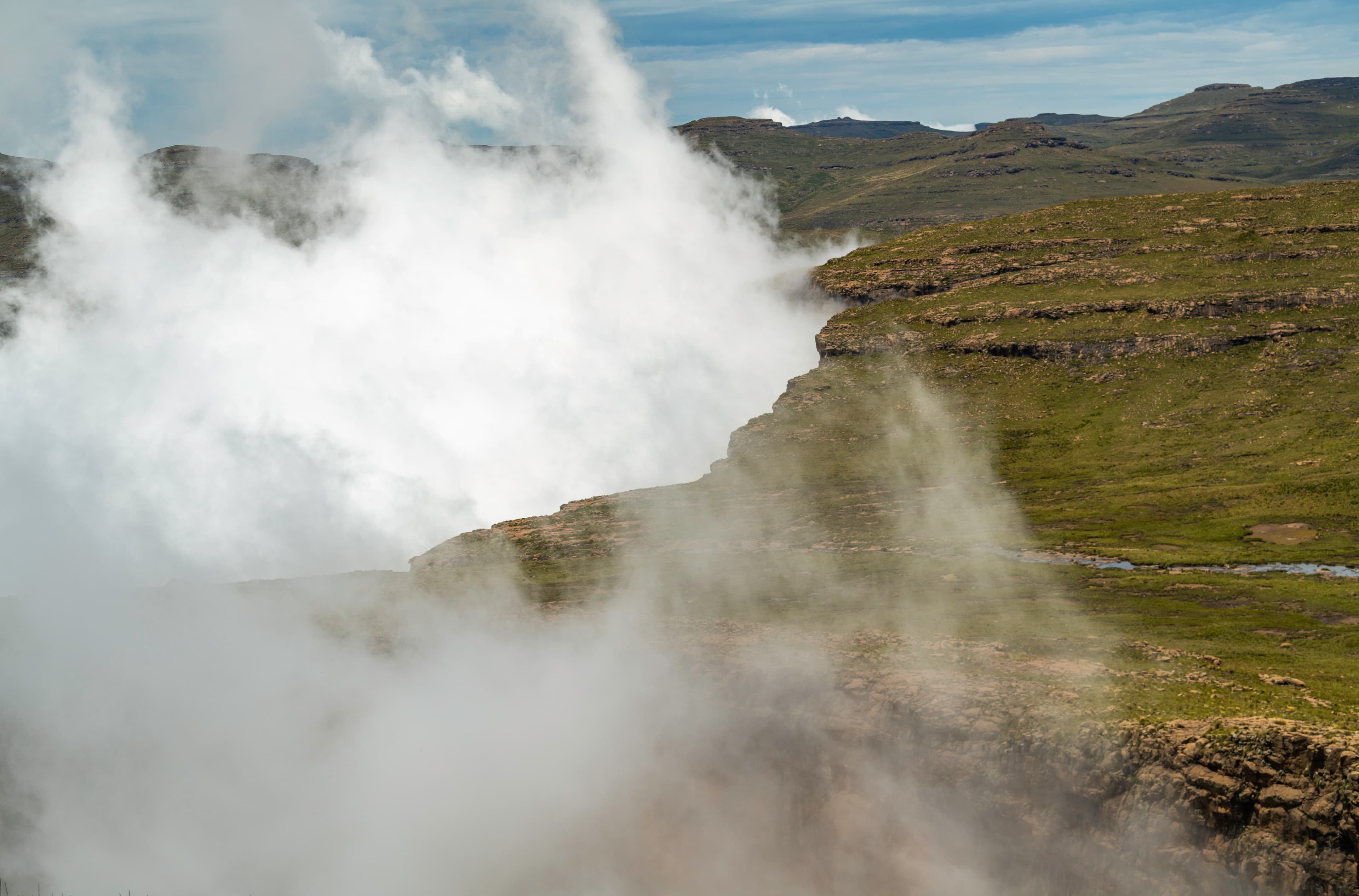 Misty cliffs shrouded in clouds, Drakensberg Mountains