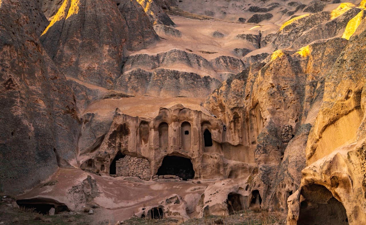 Ancient rock dwellings at sunrise, Cappadocia