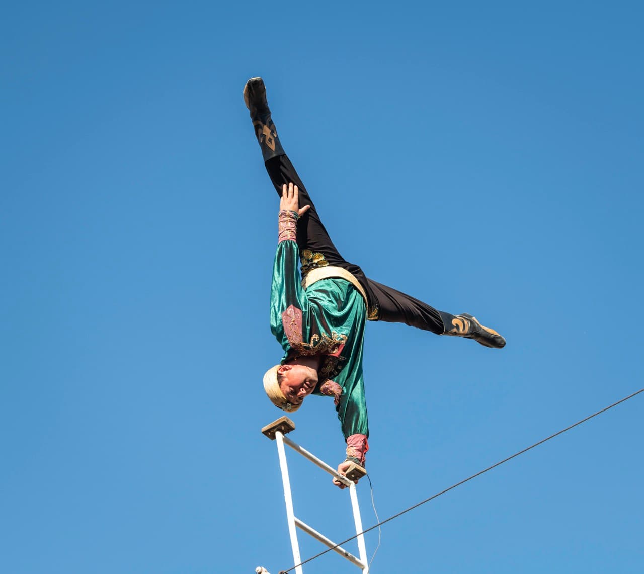 Acrobat performing on high wire, Khiva